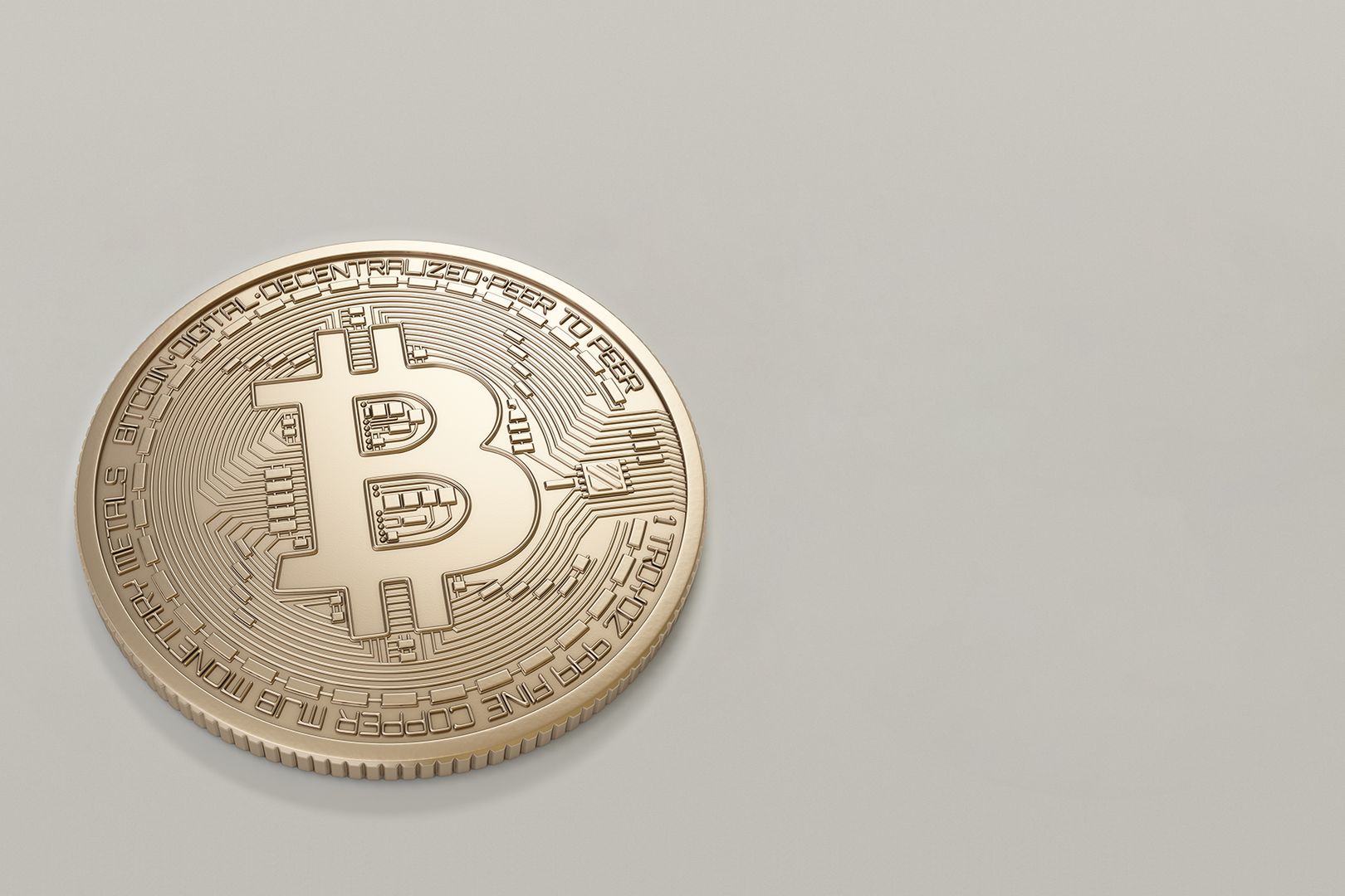 A detailed image of a Bitcoin cryptocurrency coin with a neutral background, symbolizing digital finance and currency.
